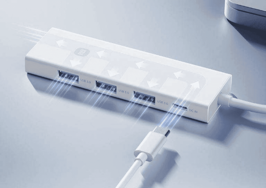 Der Xiaomi 4-in-1 Double Head Splitter ermöglicht schnelle Datenübertragungen mit bis zu 5Gbps und bietet Sicherheit gegen Überspannungen.